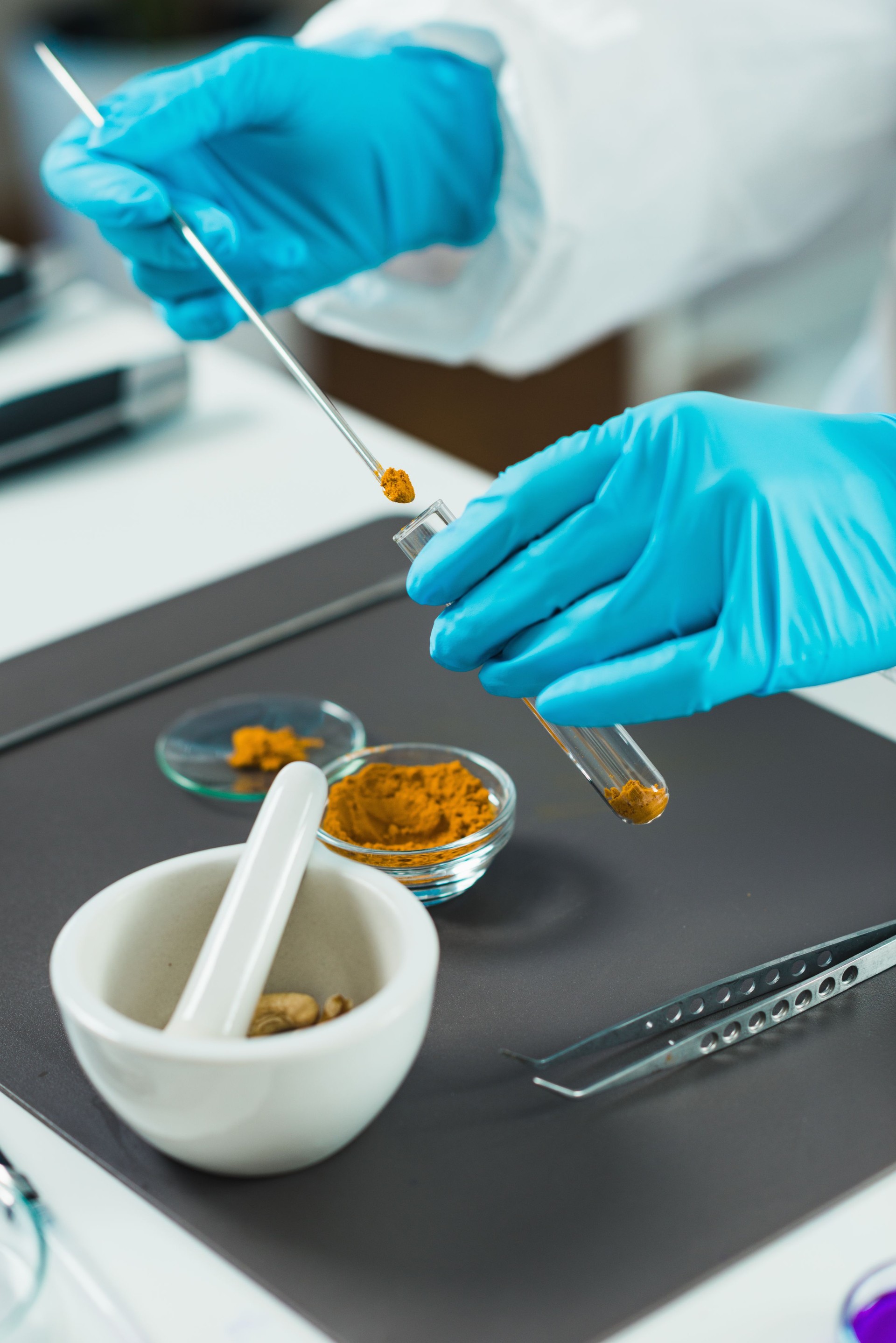 Cropped Hands Of Female Scientist Experimenting With Spice In Laboratory